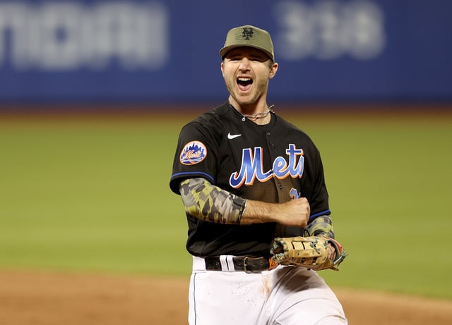 NEW YORK, NEW YORK - MAY 19: Pete Alonso #20 of the New York Mets celebrates after getting the final out of the ninth inning against the Cleveland Guardians at Citi Field on May 19, 2023 in the Flushing neighborhood of the Queens borough of New York City. Players and coaches are wearing special hats, socks and protective gear in honor of Armed Services Day.