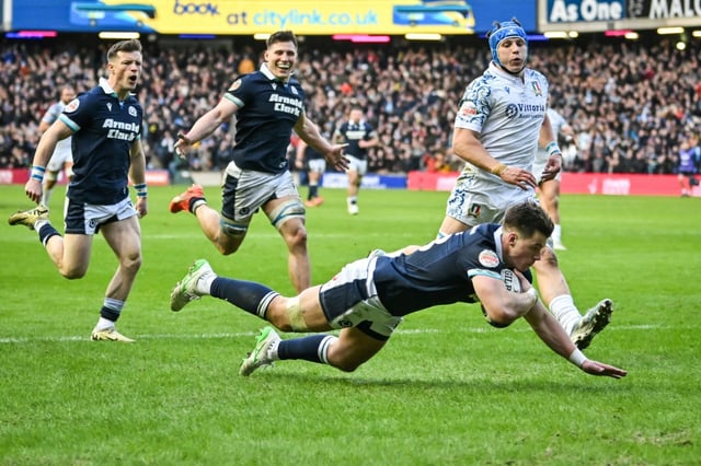 Huw Jones scores one of his three tries during Scotland's 31-19 Six Nations win over Italy at Murrayfield