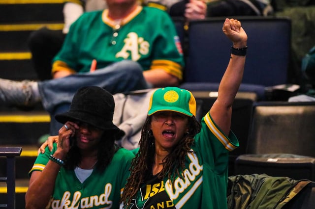 Fans cheer for the late Rickey Henderson during his celebration of life at Oakland Arena on Saturday.