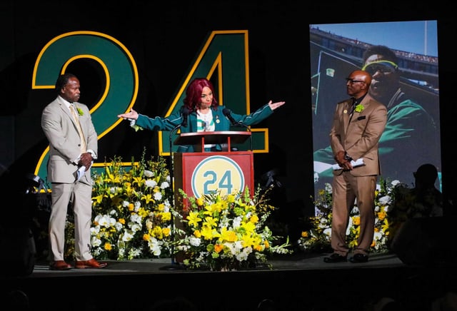Radio personality Renel Brooks-Moon is flanked by Bip Roberts, left, and Shooty Babitt, right, during A’s great Rickey Henderson’s Celebration of Life Ceremony on Saturday.