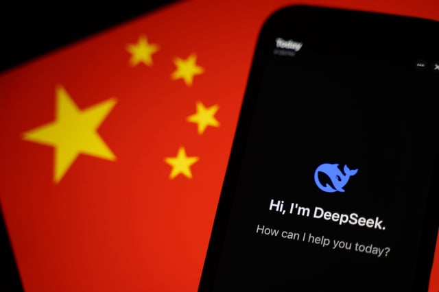 HONG KONG, CHINA - JANUARY 28: In this photo illustration, the DeepSeek apps is seen on a phone in front of a flag of China on January 28, 2025 in Hong Kong, China. Global tech stocks have plummeted following the emergence of DeepSeek, a Chinese AI startup that has developed a competitive AI model at a fraction of the cost of its US rivals, sparking concerns about the high valuations of tech giants like Nvidia. This development has led to significant declines in tech shares across Asia and Europe, with markets in both regions experiencing notable losses as investors reassess the AI landscape and its potential impact on the industry's future. (Photo illustration by Anthony Kwan/Getty Images)