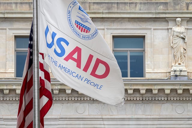 The US Agency of International Development (USAID) flag flies outside the agency's headquarters building on January 30, 2024, in Washington, DC.