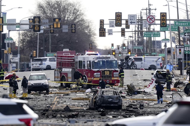 Investigators work the scene after a small plane crashed in Philadelphia, Saturday, Feb. 1, 2025. (AP Photo/Matt Rourke)