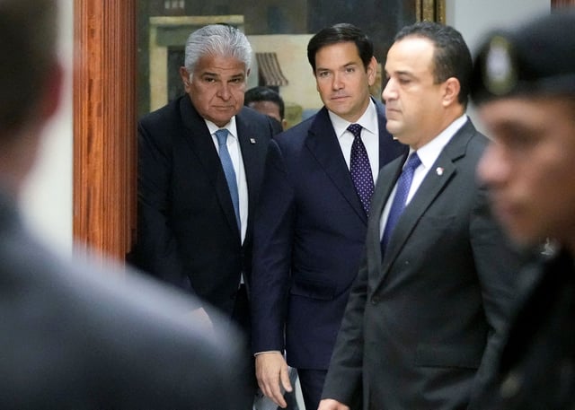 Panama's President Jose Raul Mulino (L) and US Secretary of State Marco Rubio arrive for a meeting at the presidential palace in Panama City on February 2, 2025.