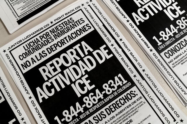 Posters to be distributed to community members ahead of anticipated raids by U.S. Immigrations and Customs (ICE) are stacked on a table in Denver, Colorado, U.S., January 29, 2025. REUTERS/Cheney Orr/File Photo