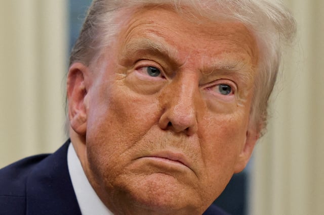 U.S. President Donald Trump looks on, on the day he signs an executive order in the Oval Office at the White House in Washington, U.S., January 31, 2025. REUTERS/Carlos Barria/File Photo