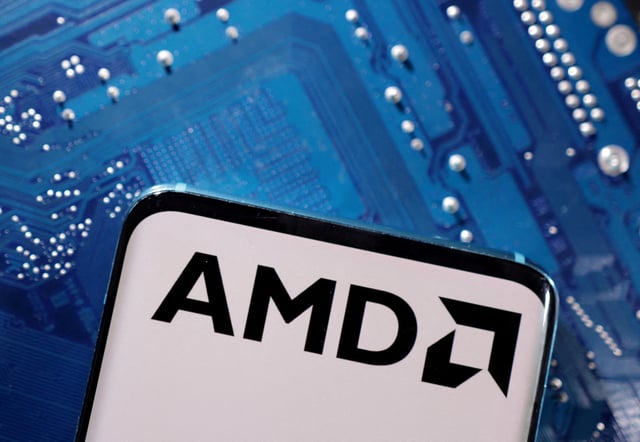 A smartphone with a displayed AMD logo is placed on a computer motherboard in this illustration taken March 6, 2023. REUTERS/Dado Ruvic/Illustration/File Photo