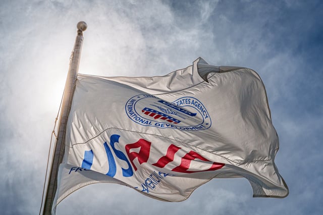 The U.S. Agency of International Development (USAID) flag flies in front of the agencys headquarters building on September 15, 2014, in Washington, DC.