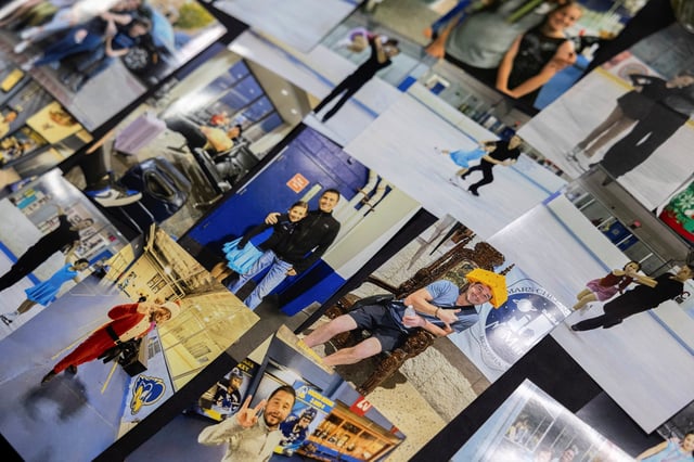 Photographs are displayed at a memorial for victims Sean Kay, Angela Yang, and Coach Sasha Kirsanov of the American Eagle flight 5342 plane crash at Fred Rust Ice Arena in Newark, Delaware, U.S. February 2, 2025.  REUTERS/Rachel Wisniewski/File Photo