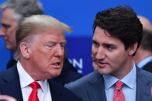 President Donald Trump talks with Canadian Prime Minister Justin Trudeau during the plenary session of the NATO summit in England on December 4, 2019.