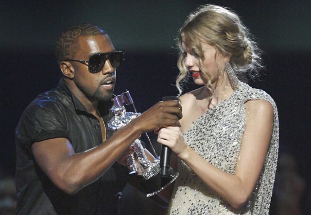 Ye, formerly Kanye West, takes the microphone from singer Taylor Swift as she accepts the “Best Female Video” award during the MTV Video Music Awards in New York. 