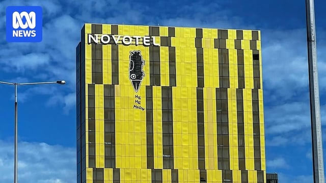 Graffiti on the side of a high-rise building