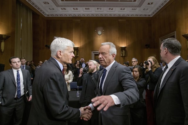 Robert F. Kennedy, Jr., right, President Donald Trump's nominee to serve as Secretary of Health and Human Services, talks with Committee Chairman Sen. Bill Cassidy, R-La., following his testimony during a Senate Committee on Health, Education, Labor and Pensions hearing for his pending confirmation on Capitol Hill, Thursday, Jan. 30, 2025, in Washington.