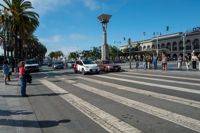 A General Motors Cruise self driving car is visible driving alongside other vehicles near the Ferry Building on the Embarcedero, San Francisco, California, August 17, 2023. (Photo by Smith Collection/Gado/Getty Images)