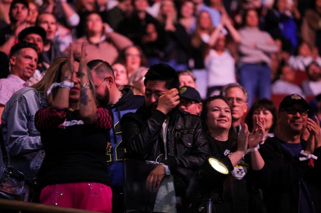 People react during the FireAid benefit concert for Los Angeles wildfire relief efforts, in Inglewood, California, U.S., January 30, 2025. REUTERS/Daniel Cole/File Photo