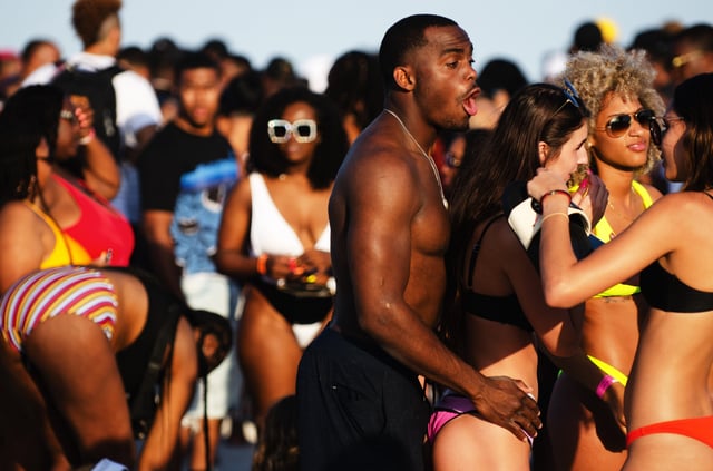 Young people gather on South Beach for the annual spring break vacation from schools and colleges.