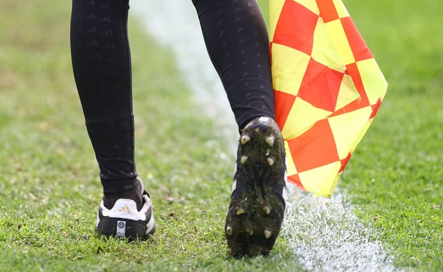 Soccer Football - FIFA Women's World Cup Australia and New Zealand 2023 - Referee Media Day - Referees' Base Camp Training Site, Sydney Olympic Park Athletic Centre, Sydney, Australia - July 18, 2023 A referee's shoes and the offside flag are pictured during the event REUTERS/Carl Recine/File Photo