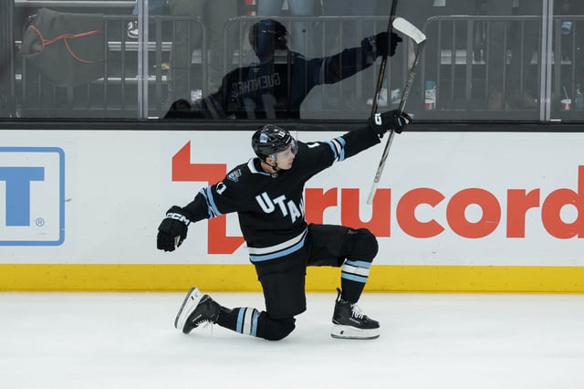Feb 4, 2025; Salt Lake City, Utah, USA;  Utah Hockey Club right wing Dylan Guenther (11) celebrates scoring the game winning goal in overtime against the Philadelphia Flyers at Delta Center. Mandatory Credit: Chris Nicoll-Imagn Images