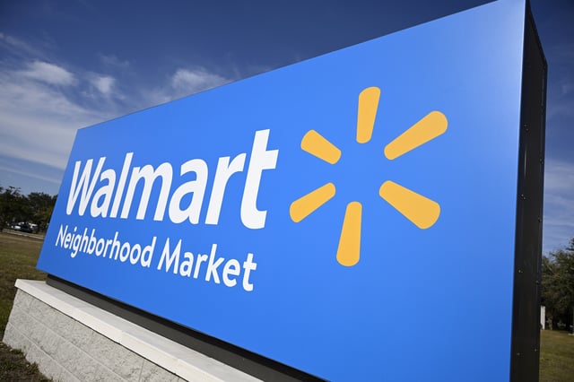 A sign is viewed outside of a Walmart Neighborhood Market, Wednesday, Jan. 29, 2025, in Orlando, Florida.