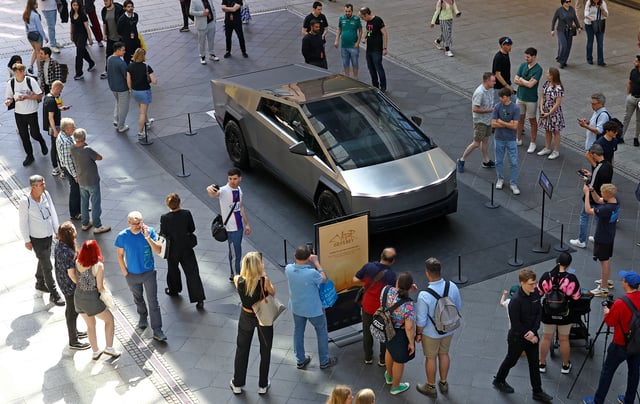 People gather around the Cybertruck vehicle by Tesla at the Mall of Berlin in Berlin, Germany, May 2, 2024. REUTERS/Lisi Niesner/File Photo