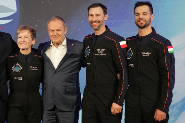 U.S. astronaut Peggy Whitson, commander of the Ax-4 space mission, left, Poland's Prime Minister Donald Tusk, center, Polish member of the mission crew, astronaut Slawosz Uznanski-Wisniewski, and Tibor Kapu of Hungary, right, pose during a media event dedicated to the preparations for the mission, at the Copernicus Science Center in Warsaw, Poland, Wednesday, Feb. 5, 2025. (AP Photo/Czarek Sokolowski)