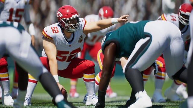 Football players preparing on the green in Madden NFL 25.
