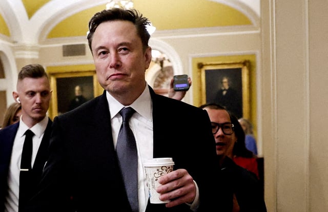 Elon Musk walks on Capitol Hill on the day of a meeting with Senate Republican Leader-elect John Thune (R-SD), in Washington, U.S. December 5, 2024. REUTERS/Benoit Tessier/File Photo