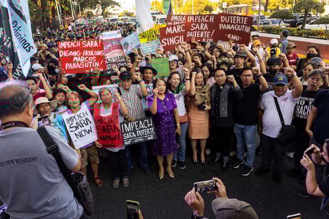 Activists and students pose with some members of the Congress who voted to impeach Philippine Vice President Sara Duterte, at a rally outside the House of Representatives in Quezon City, Metro Manila, Philippines, February 5, 2025. REUTERS/Eloisa Lopez