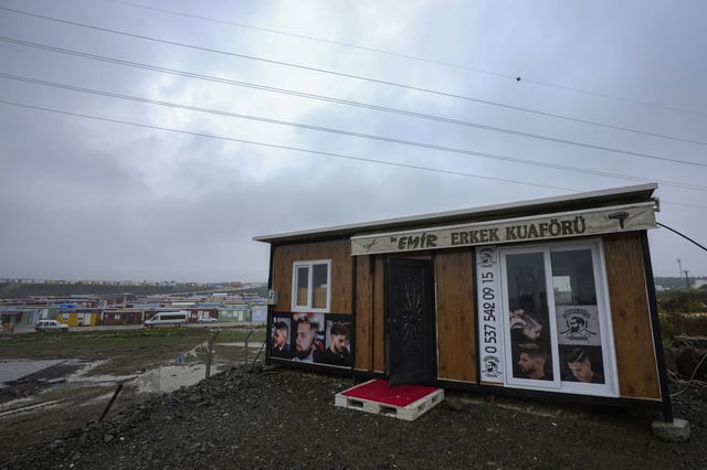 FILE - A container that was turned into a barber shop by its owner whose business was destroyed in the powerful earthquake in 2023, in Antakya, southern Turkey, Friday, Jan. 12, 2024. (AP Photo/Khalil Hamra, File)