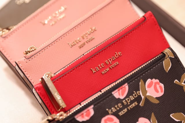 Items are seen in a Kate Spade store, owned by Tapestry, Inc., in Manhattan, New York, U.S., November 19, 2021. REUTERS/Andrew Kelly/File Photo