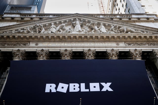 The Roblox logo is displayed on a banner, to celebrate the company's IPO, on the front facade of the New York Stock Exchange (NYSE) in New York, U.S., March 10, 2021. REUTERS/Brendan McDermid/File Photo