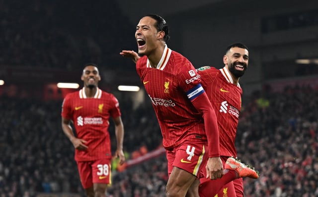 Soccer Football - Carabao Cup - Semi Final - Second Leg - Liverpool v Tottenham Hotspur - Anfield, Liverpool, Britain - February 6, 2025 Liverpool's Virgil van Dijk celebrates scoring their fourth goal with Mohamed Salah REUTERS/Dylan Martinez