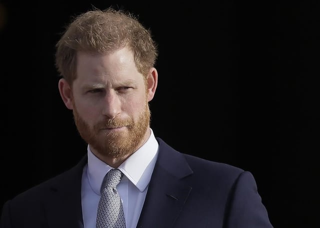 FILE - Britain's Prince Harry arrives in the gardens of Buckingham Palace in London, Jan. 16, 2020. 