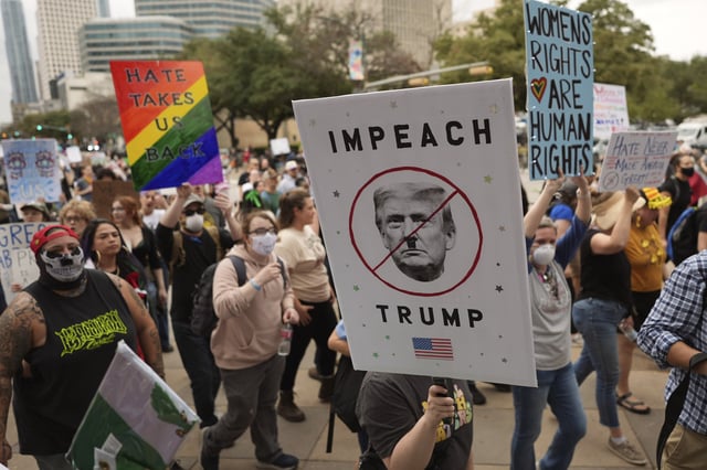 Protesters march to the Texas Capitol, Wednesday, Feb. 5, 2025, in Austin, Texas.