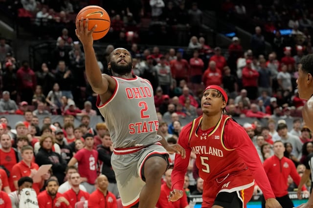 Ohio State guard Bruce Thornton (2) goes to the basket past Maryland guard DeShawn Harris-Smith (5) in the second half of an NCAA college basketball game Thursday, Feb. 6, 2025, in Columbus, Ohio. (AP Photo/Sue Ogrocki)
