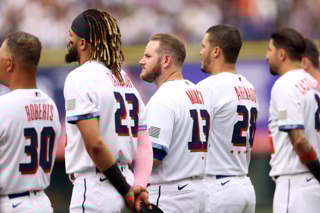 The National League All-Stars line up for the national anthem prior to the start of the 91st MLB All-Star Game at Coors Field on July 13, 2021 in Denver, Colorado.