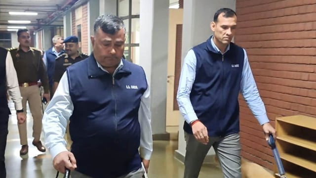 FILE: A bomb squad team search a school after several schools received a bomb threats, in Noida, 