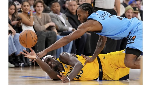 Indiana Pacers forward Pascal Siakam, left, passes the ball while under pressure from Clippers forward Kawhi Leonard during the second half on Thursday night at the Intuit Dome in Inglewood. (AP Photo/Mark J. Terrill)