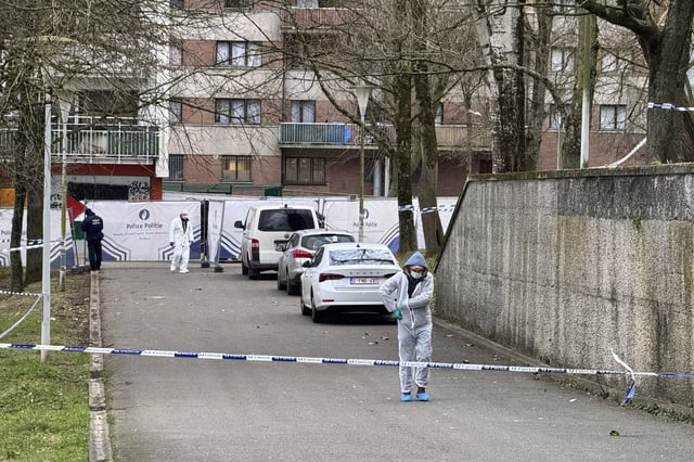 Police work in an area around an apartment complex after a shooting incident in Brussels, Friday, Feb. 7, 2025. (AP Photo/Sylvain Plazy)