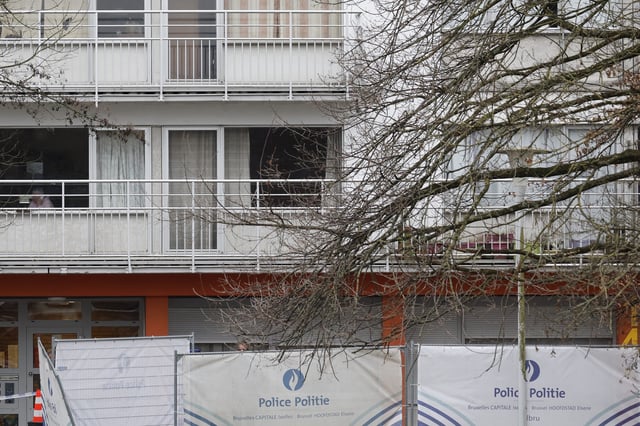 A police screen encloses an area around an apartment complex after a shooting incident in Brussels, Friday, Feb. 7, 2025. (AP Photo/Geert Vanden Wijngaert)