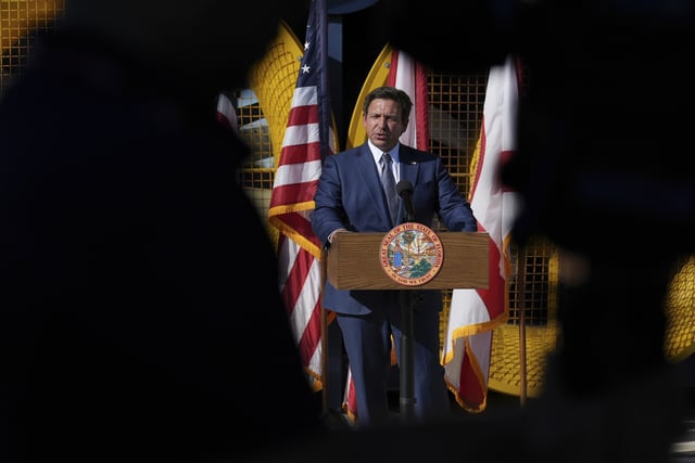 Florida Gov. Ron DeSantis speaks about plans to lower insurance prices in the state, during a press conference at Florida International University's Wall of Wind, an experimental facility focused on wind engineering research, Wednesday, Feb. 5, 2025, in Miami. (AP Photo/Rebecca Blackwell)
