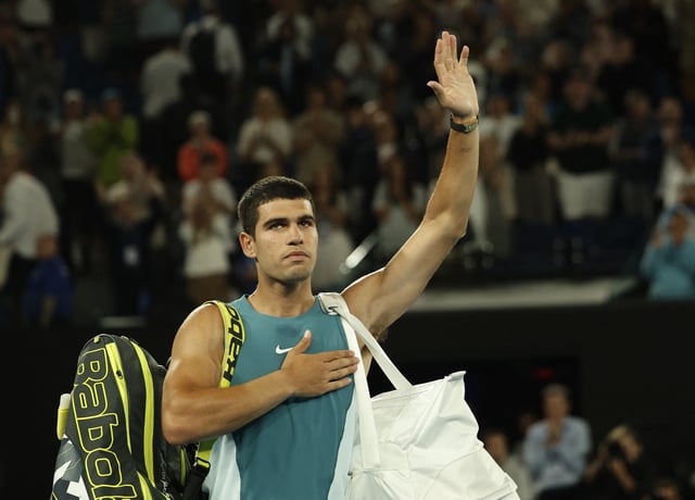 Tennis - Australian Open - Melbourne Park, Melbourne, Australia - January 22, 2025 Spain's Carlos Alcaraz reacts after losing his quarter final match against Serbia's Novak Djokovic REUTERS/Francis Mascarenhas/File Photo