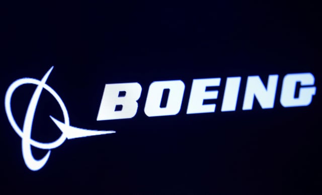 The company logo for Boeing is displayed on a screen on the floor of the New York Stock Exchange (NYSE) in New York, U.S., March 11, 2019. REUTERS/Brendan McDermid/File Photo
