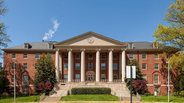 04-20-2021 Bethesda, Maryland, USA: Bethesda Campus of the National Institutes of Health with the main historical building (Building 1) at the focus.