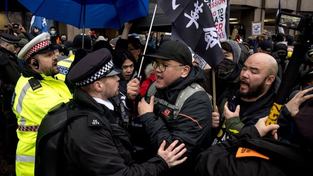 Police officers scuffled with protesters objecting to the Chinese government’s plans for an embassy at Royal Mint Court