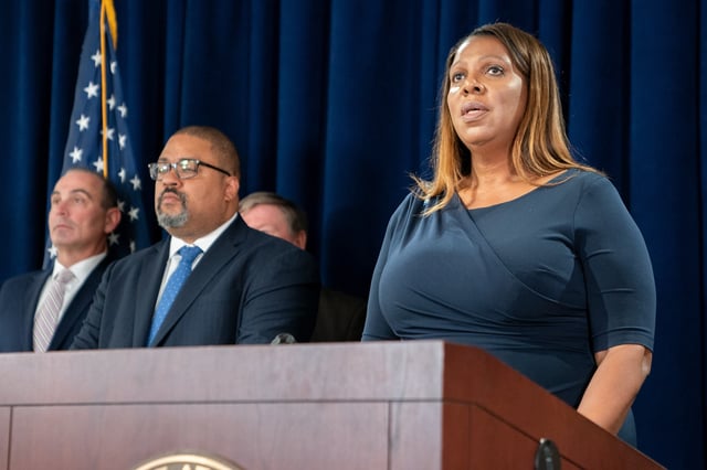 New York State Attorney General Letitia James (R) speaks as Manhattan District Attorney Alvin Bragg looks on during a press conference after Steve Bannon, former advisor to former President Donald Trump surrendered at the NY District Attorney&#39;s office to face charges on September 08, 2022 in New York City.