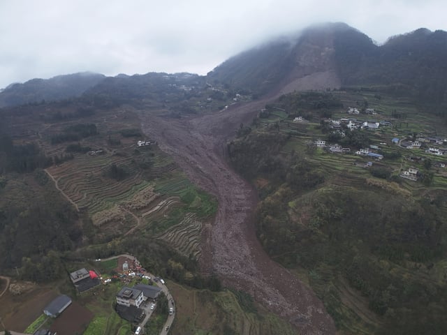 In this photo released by Xinhua News Agency, an aerial drone photo shows the site of a landslide in Jinping Village, Junlian County in the city of Yibin, southwest China&#39;s Sichuan Province, on February 8, 2025.