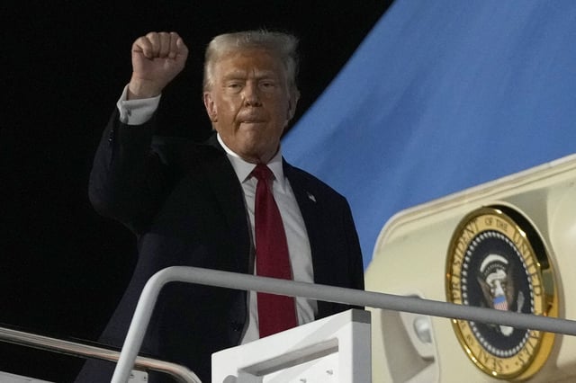 President Donald Trump gestures as he boards Air Force One at the Naval Air Station Joint Reserve Base in New Orleans, Sunday, Feb. 9, 2025. 