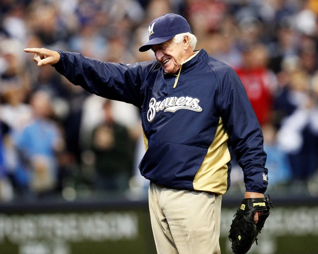 Former player and sportscaster Bob Uecker gestures after throwing out the opening pitch before the Game 1 of the MLB National League Division Series between Milwaukee Brewers and the Arizona Diamondbacks in Milwaukee, Wisconsin, October 1, 2011. REUTERS/Jeff Haynes/File Photo