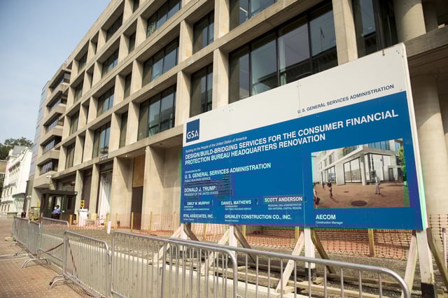 FILE - A sign stands at the construction site for the Consumer Financial Protection Bureau's headquarters in Washington, Aug. 27, 2018. (AP Photo/Andrew Harnik, file)